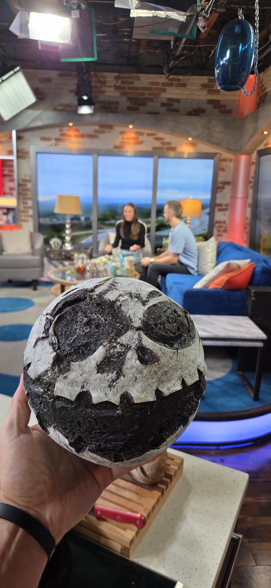 Jack Skellington face scored into a sourdough loaf, photographed at the FOX 13 studio